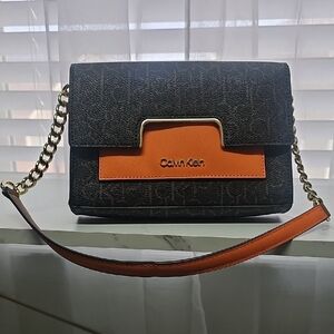 Calvin Klein Black and Orange Crossbody Bag with Gold Accents